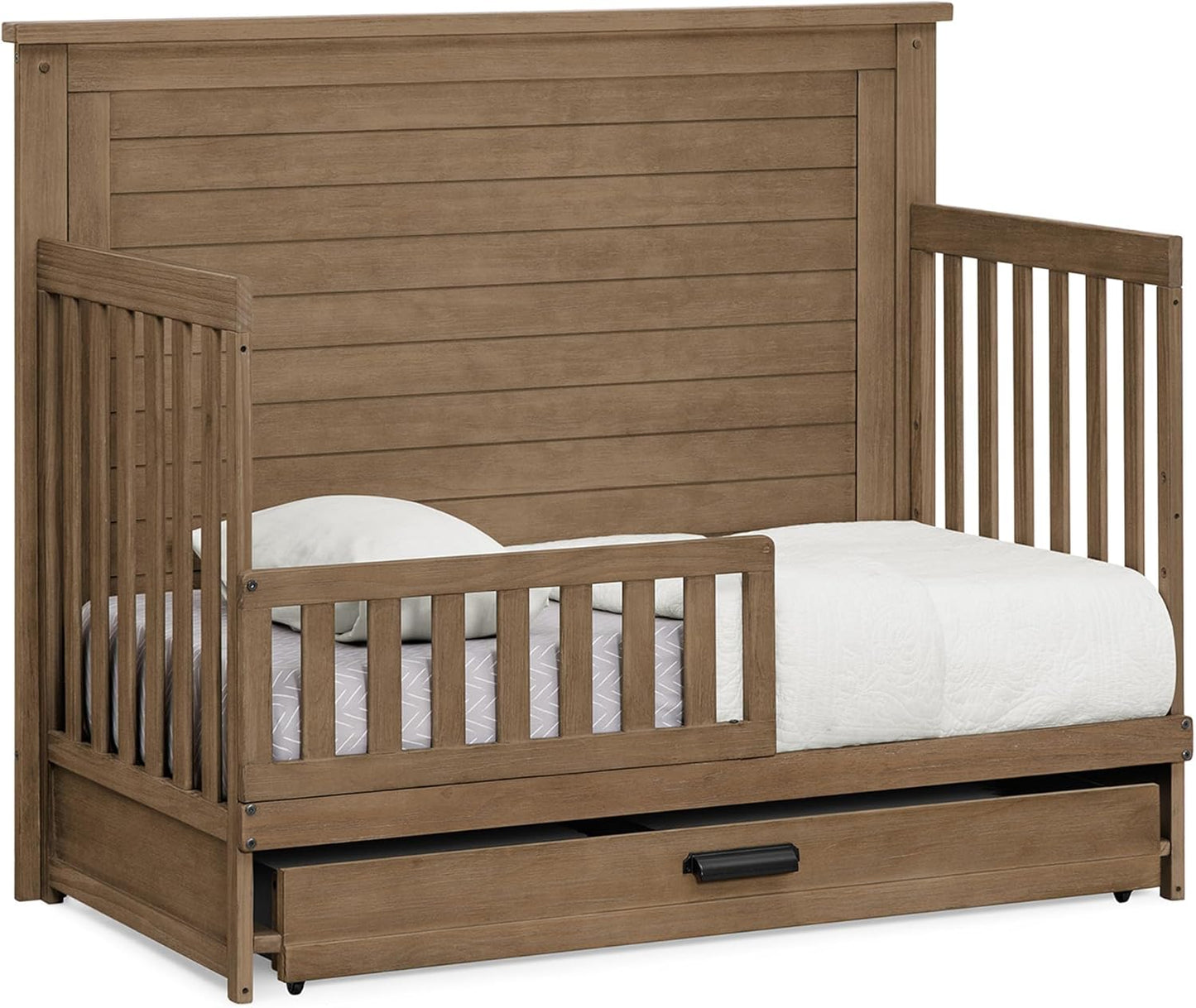 Delta Children Simmons Kids Caden 6-in-1 Convertible Crib with Trundle Drawer, Greenguard Gold Certified, Aged Oak